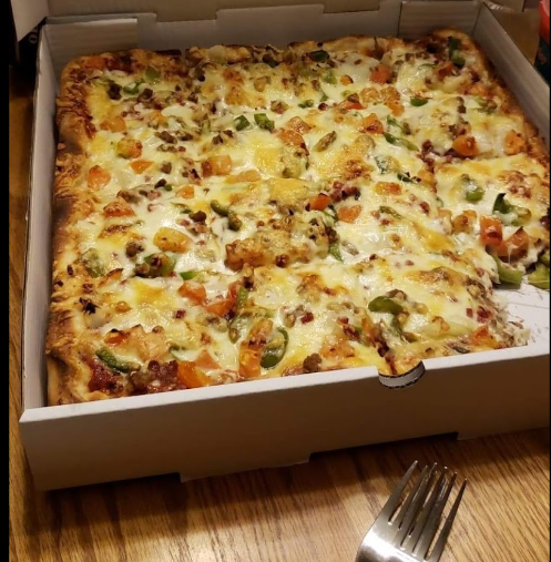 Square deep dish pizza with fresh toppings in Edgemont, Calgary